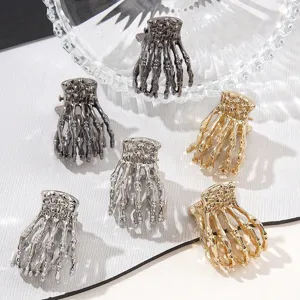 Gothic metal skeleton hand hair claw clips in gold and silver for Halloween styling