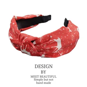 Festive Christmas red fabric knotted headband with reindeer and snowflake patterns