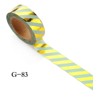 Gold foil and light green striped washi tape for journaling, crafts, and DIY decoration.