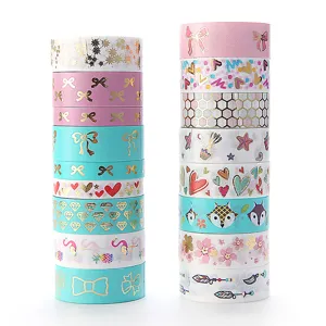 Decorative washi tape sets with gold foil patterns, colorful craft tape rolls for journaling and DIY.