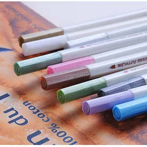 Metallic brush pens set, colorful caps, smooth writing for art drawing and graffiti.