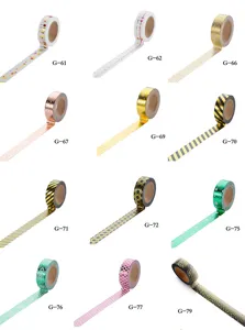 Details of DIY gold foil washi tape rolls, decorative patterned paper tapes for journal.