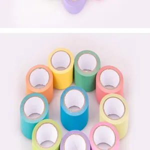 Detailed close-up view of colorful washi tape rolls for DIY journal decoration..