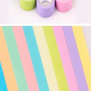 Colorful washi tape detail shot, pastel rainbow adhesive tape for DIY journal decoration.