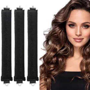 Close-up of three black heatless hair curlers with hooks showing wavy hair result