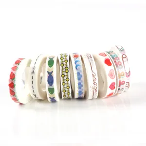 Decorative washi tape set with cute patterns like strawberries hearts and fish for journals.
