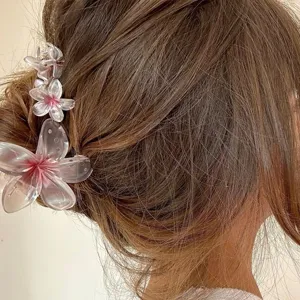 Elegant gradient transparent plumeria floral hair claw clip, perfect summer hair accessory.