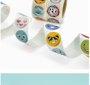 Roll of cute cartoon expression and animal round stickers for journal decoration and sealing.