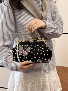Bolso de noche vintage de terciopelo negro con bordado de mariposa y perlas