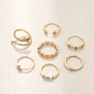 Lot de 7 bagues de phalange dorées avec des motifs créatifs de serpent et de lune et de strass.