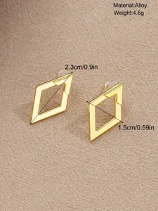Detailed view of gold geometric rhombus earrings with material and size measurements