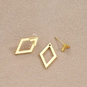 Detail showing the unique assembly of golden minimalist geometric rhombus hollow earrings