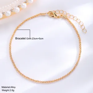 Detailed shot of sparkling gold anklet featuring 23cm+5cm length and alloy material specs