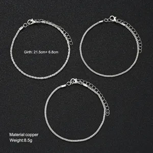 Detailed shot of 3-piece sparkling silver anklet set showing size and material.