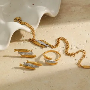 Detailed view of 18K gold plated fish jewelry set with bracelet, ring and earrings