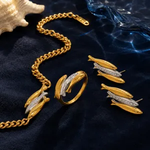 Exquisite triple fish jewelry set with gold ring, bracelet and stud earrings on blue velvet
