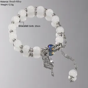 Detailed view of handmade beaded bracelet with glass butterfly charm and 20cm girth