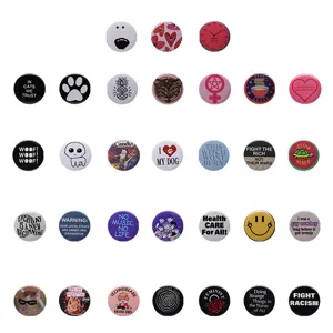 Collection of various aesthetic pinback buttons with English quotes and cartoon characters.