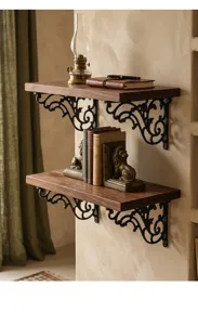 Close-up of decorative iron shelf brackets supporting dark wood planks in a study.