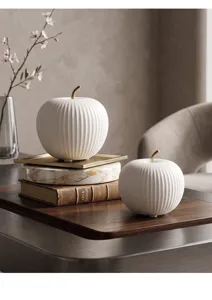 Elegant Nordic white ceramic apple ornament with ribbed texture and gold stem detail