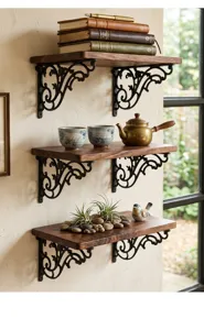 Close-up of ornate vintage black cast iron shelf brackets supporting wooden shelves.