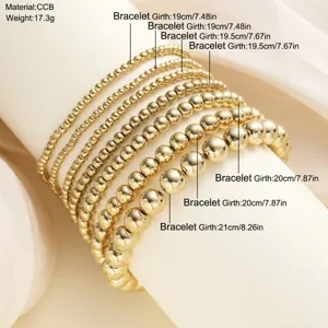 Detail van een 7-delige gouden kralenarmbandset met info over materiaal en afmeting