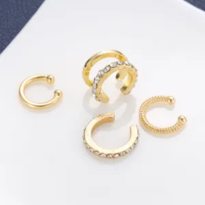 Detailed macro view of a 4-piece set of gold-toned non-pierced crystal ear cuffs.