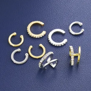Detailed close-up shot of various C-shaped non-piercing ear cuffs with sparkling rhinestones