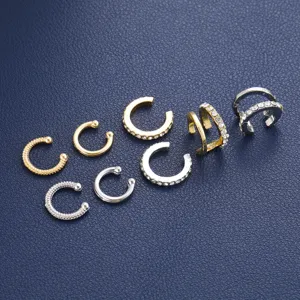 Detailed view of mixed gold and silver non-pierced C-shaped ear cuffs with rhinestones