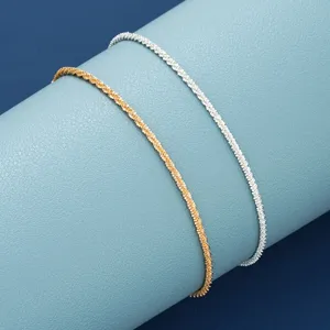 Detailed view of textured gold and silver anklet set with sparkling finish for women