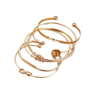 Elegant 5-piece gold geometric open cuff bracelet set with knot and bead details