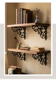 Ornate vintage cast iron shelf brackets holding rustic wooden wall shelves in a study