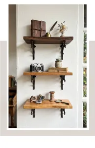 Staffe da parete decorative rustiche in ghisa per mensole in legno su parete bianca