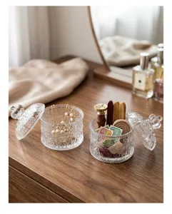 Close-up of elegant Nordic embossed glass jewelry boxes for home storage and decor