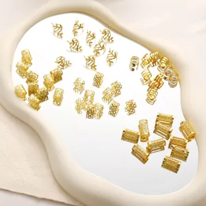 Macro view of golden hollow hair jewelry rings with various patterns on a mirror