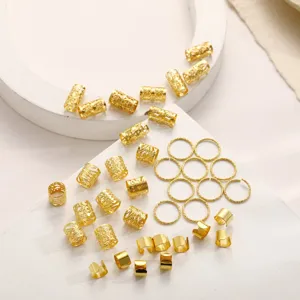 Detailed close-up showing 40 golden hair braid accessories with hollowed patterns and rings
