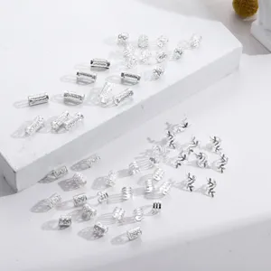 Macro view of 50pcs silver hollow dreadlock jewelry rings and leaf shape hair cuffs