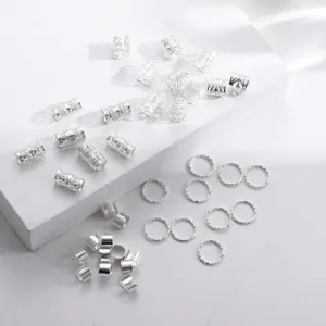 Detail showing various silver filigree hair cuffs and textured rings for DIY braiding