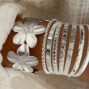 Bohemian silver stacking bangle set with an exaggerated floral cuff bracelet for women