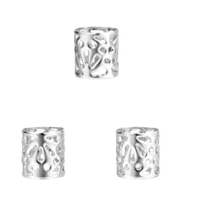 Set of three hollow silver dreadlock hair extension jewelry rings on white background.