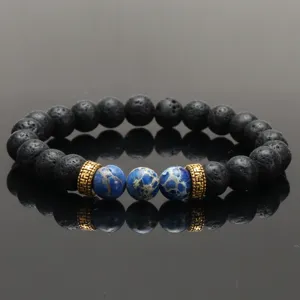 Natural lava stone and blue imperial jasper beaded bracelet with gold spacer beads for yoga energy.
