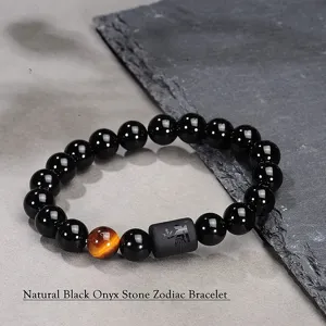 Pulsera zodiacal de ónyx negro natural con piedra de ojo de tigre y abalorio grabado.