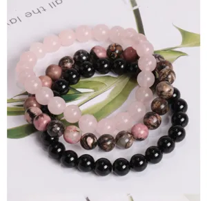 Detailansicht des Naturstein Perlenarmband Sets, Rosenquarz und schwarze Edelsteine Yoga.