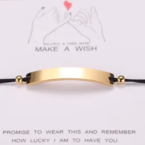 Stainless steel curved bar couple bracelet with wish card, adjustable black cord design.