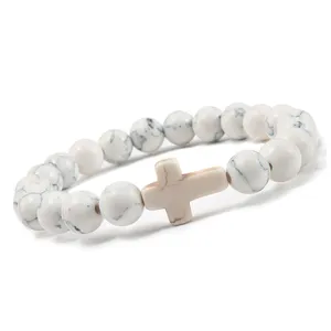 Pulsera de cuentas de turquesa blanca con cruz, ideal para yoga y uso diario espiritual.