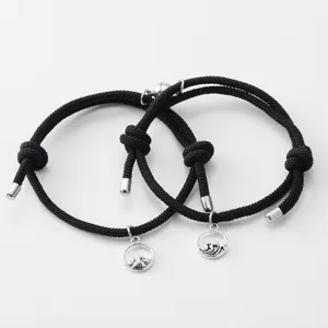 Bracelets tressés magnetiques de couple avec amulettes de montagne et de vague