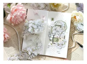 Detailed view of floral PET masking tape applied to a vintage-style scrapbook page