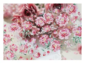 Detailed view of floral PET tape with iridescent shell light finish for journaling