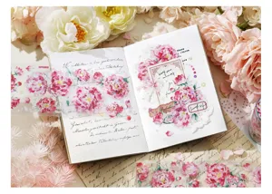 Close-up detail of vintage floral PET tape with shell light finish on journal pages