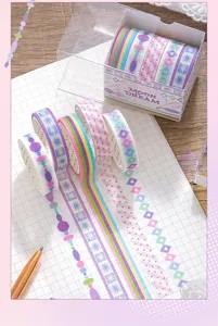 Vue détaillée du kit de rubans washi Moon Dream pailletés sur un carnet quadrillé